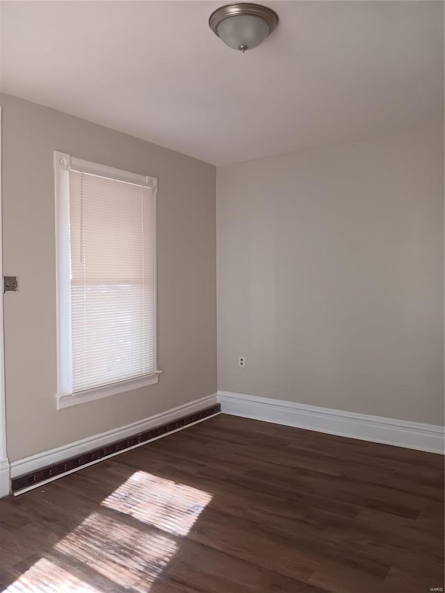 empty room featuring dark hardwood / wood-style floors