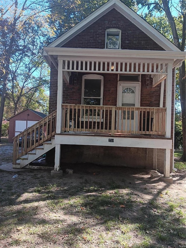 rear view of house with covered porch