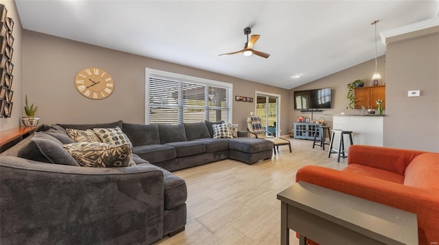 living room with ceiling fan and lofted ceiling