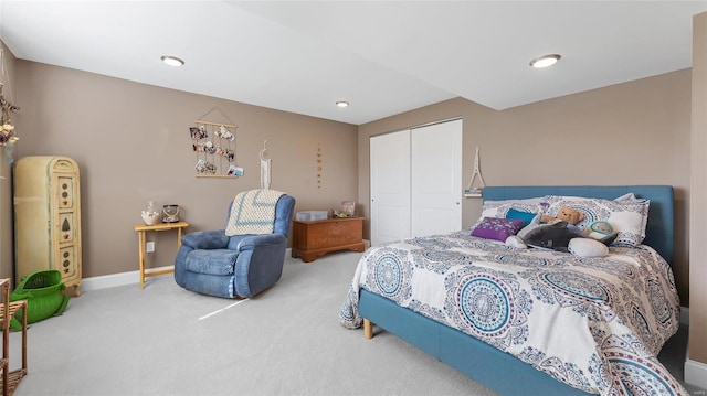 carpeted bedroom with a closet