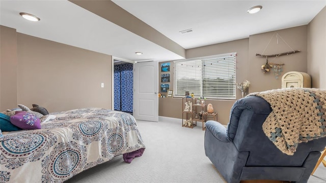 bedroom with light colored carpet