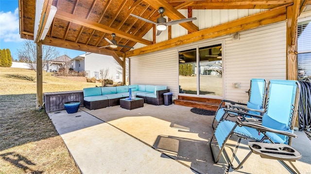 view of patio / terrace with ceiling fan and an outdoor living space