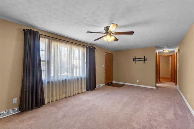 unfurnished room with carpet floors and ceiling fan