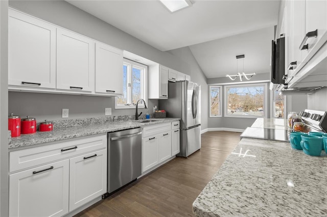 kitchen with stainless steel appliances, sink, and white cabinets