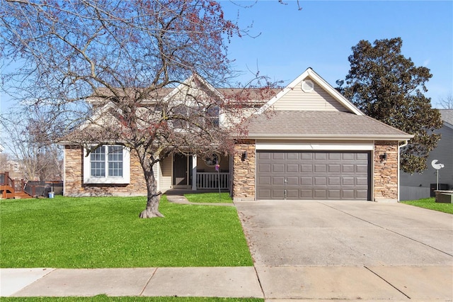 view of front of property with a garage and a front lawn