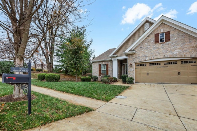 craftsman-style house with a front yard and a garage