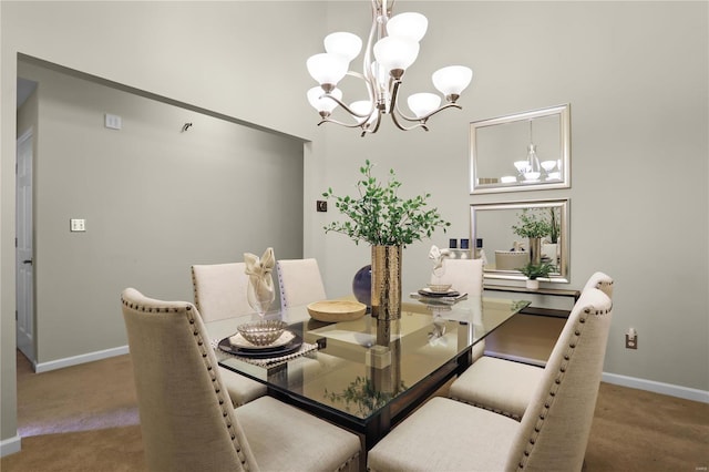 dining area featuring carpet and a notable chandelier