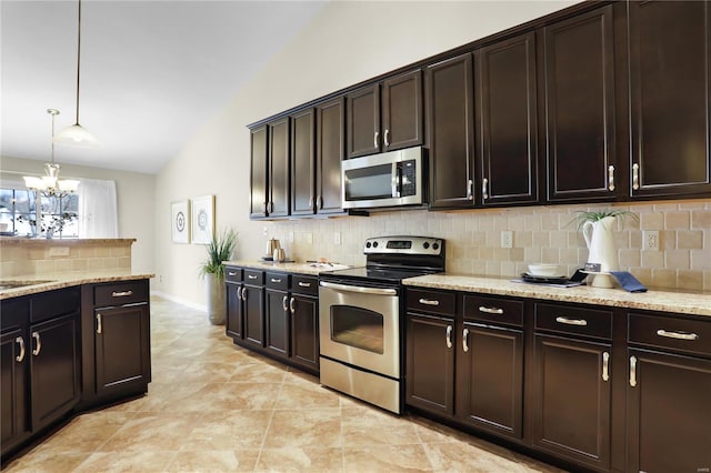 kitchen featuring pendant lighting, dark brown cabinetry, appliances with stainless steel finishes, lofted ceiling, and decorative backsplash