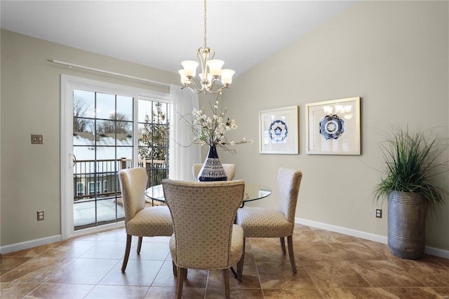 dining space featuring a notable chandelier and lofted ceiling