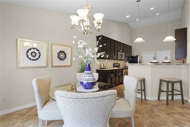 dining area featuring a notable chandelier and vaulted ceiling