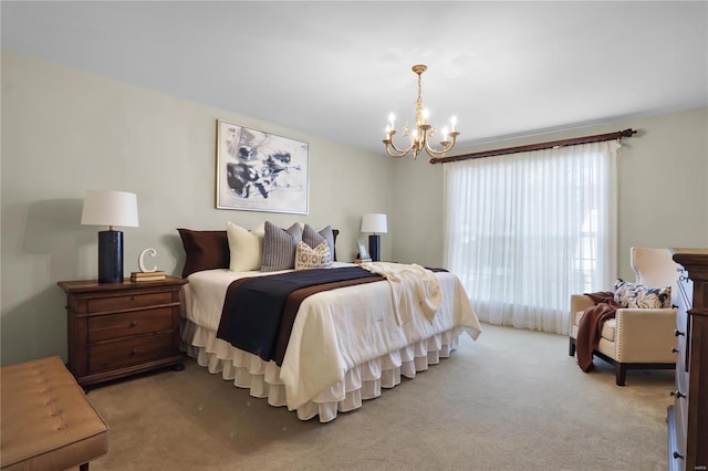 carpeted bedroom featuring an inviting chandelier