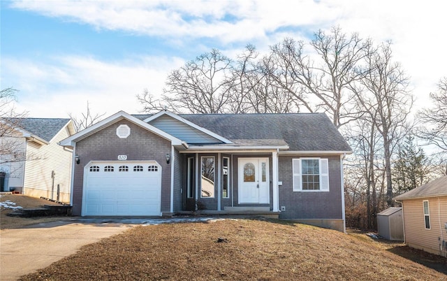 single story home featuring a garage and a front lawn