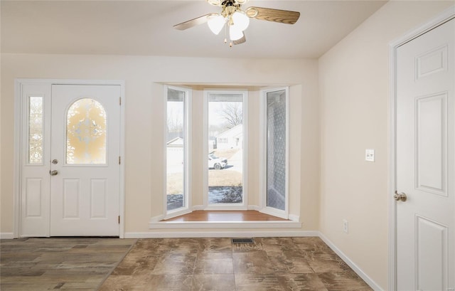 entryway with a wealth of natural light and ceiling fan