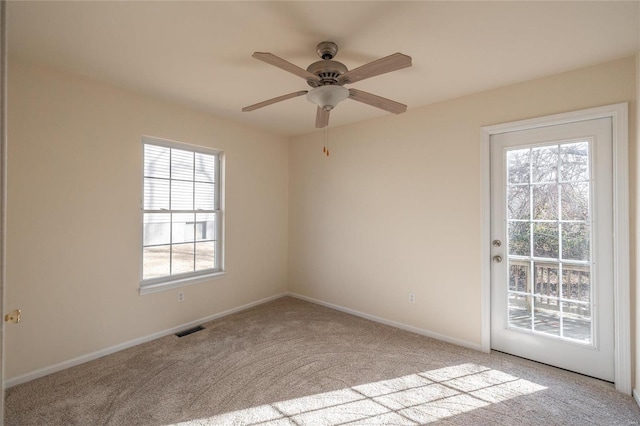 carpeted empty room with ceiling fan