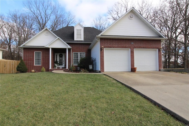 view of front of house featuring a garage and a front yard