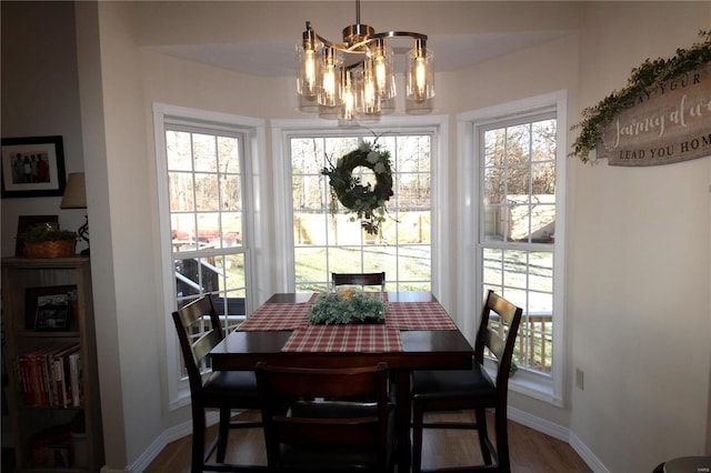 dining room with a notable chandelier and a wealth of natural light