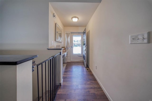 corridor with dark wood-type flooring