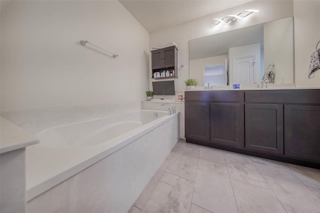 bathroom featuring vanity and a tub