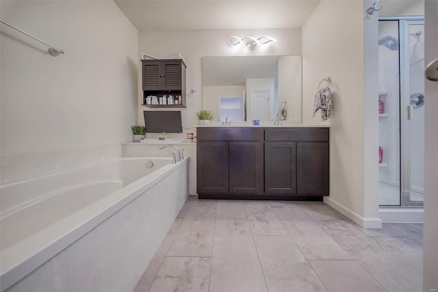 bathroom with shower with separate bathtub and vanity