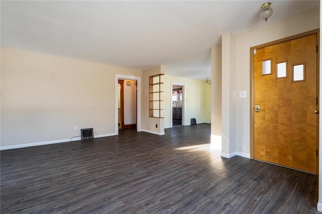 foyer entrance with dark hardwood / wood-style flooring