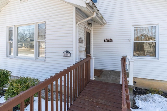 view of snow covered property entrance