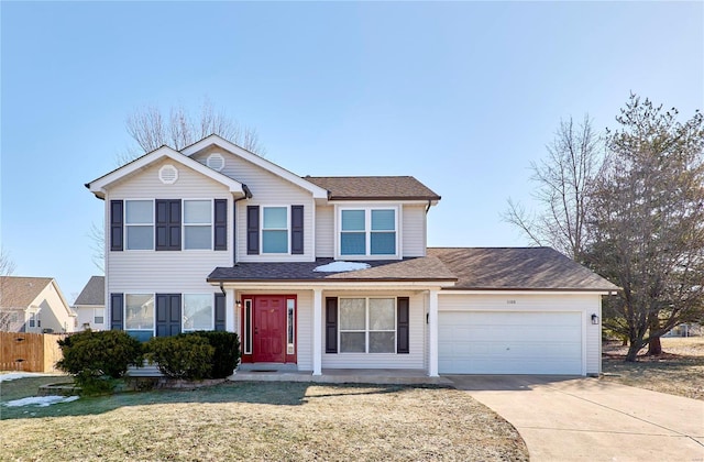 view of front of home featuring a garage and a front lawn