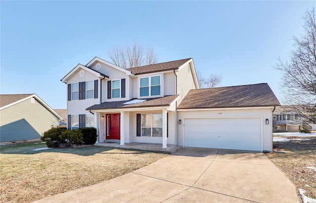 front facade with a garage, a front yard, and covered porch