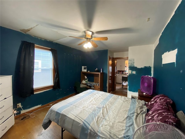 bedroom featuring ceiling fan and hardwood / wood-style floors