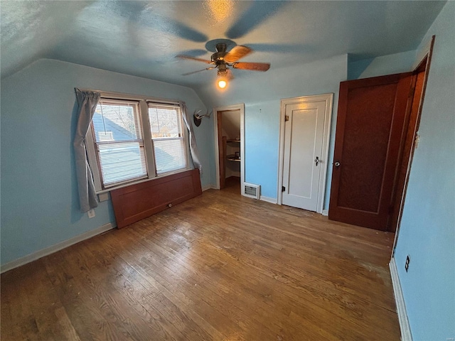 additional living space featuring ceiling fan, vaulted ceiling, and hardwood / wood-style floors