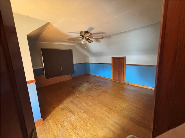 bonus room with light hardwood / wood-style flooring, ceiling fan, and vaulted ceiling