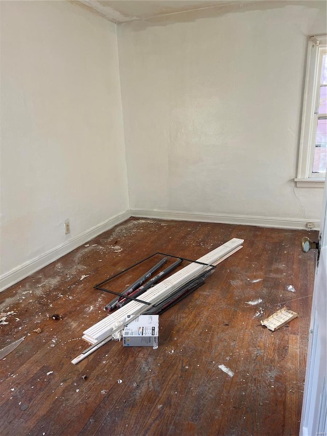 unfurnished room featuring wood-type flooring