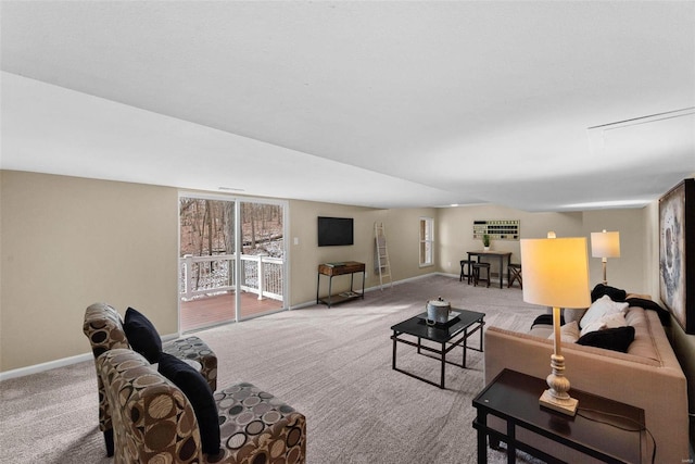 living room featuring carpet, a wealth of natural light, and baseboards