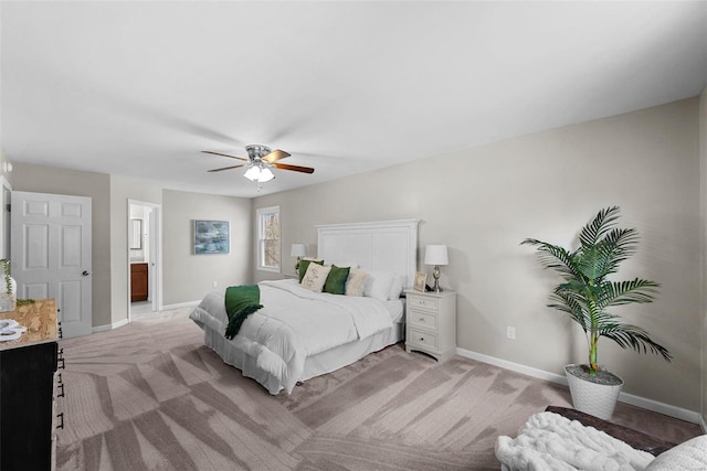 bedroom featuring light carpet, ceiling fan, and baseboards