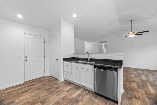 kitchen with dishwasher, lofted ceiling, dark wood-type flooring, white cabinetry, and sink