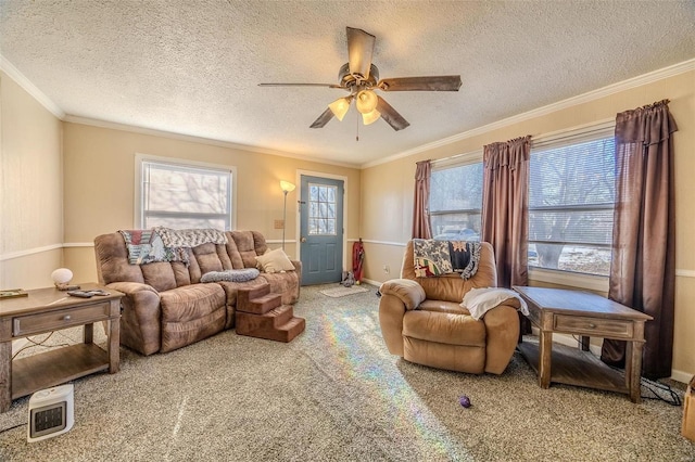 carpeted living room with crown molding, a textured ceiling, and ceiling fan