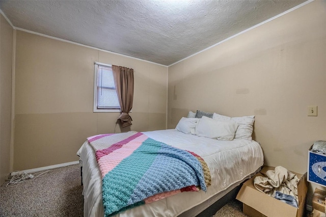 carpeted bedroom with a textured ceiling