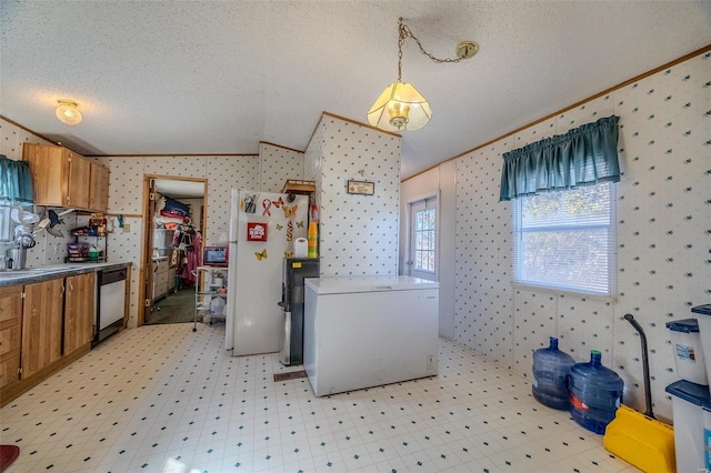 kitchen featuring crown molding, a textured ceiling, dishwasher, and fridge