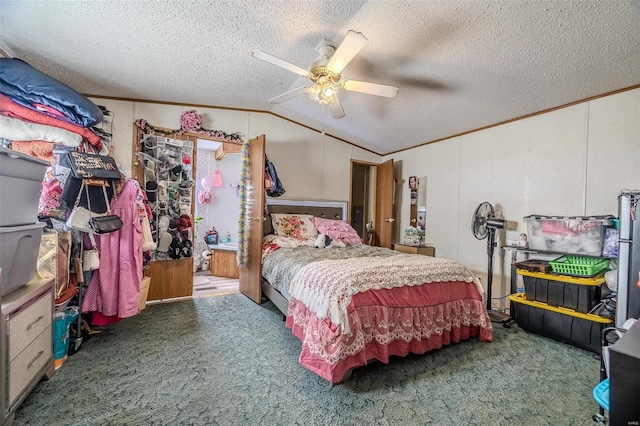 carpeted bedroom with ceiling fan, a textured ceiling, ornamental molding, and lofted ceiling