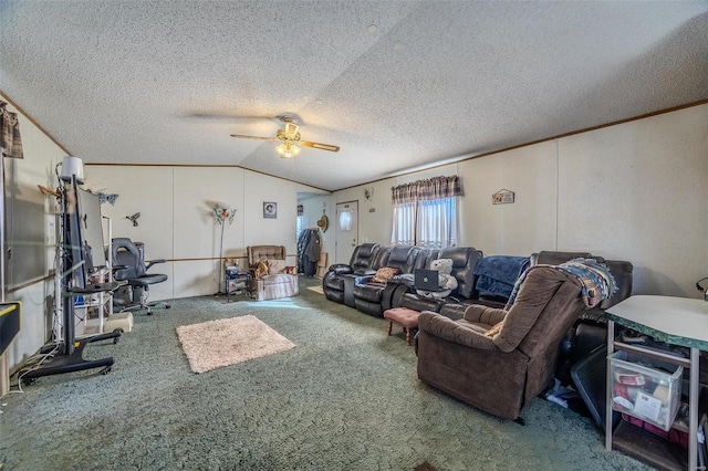 living room with ceiling fan, carpet flooring, ornamental molding, and vaulted ceiling