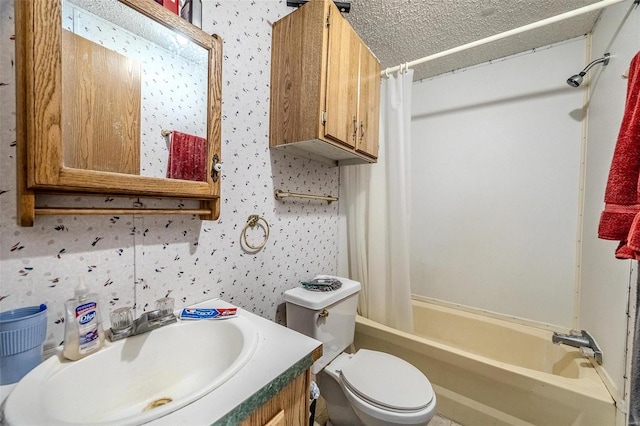 full bathroom with vanity, toilet, shower / tub combo, and a textured ceiling