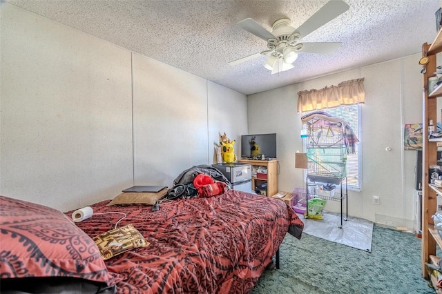 bedroom featuring ceiling fan, carpet flooring, and a textured ceiling