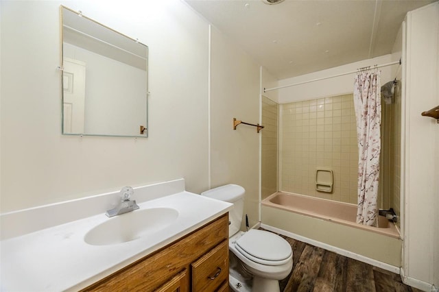 full bathroom featuring shower / bath combo with shower curtain, wood-type flooring, toilet, and vanity