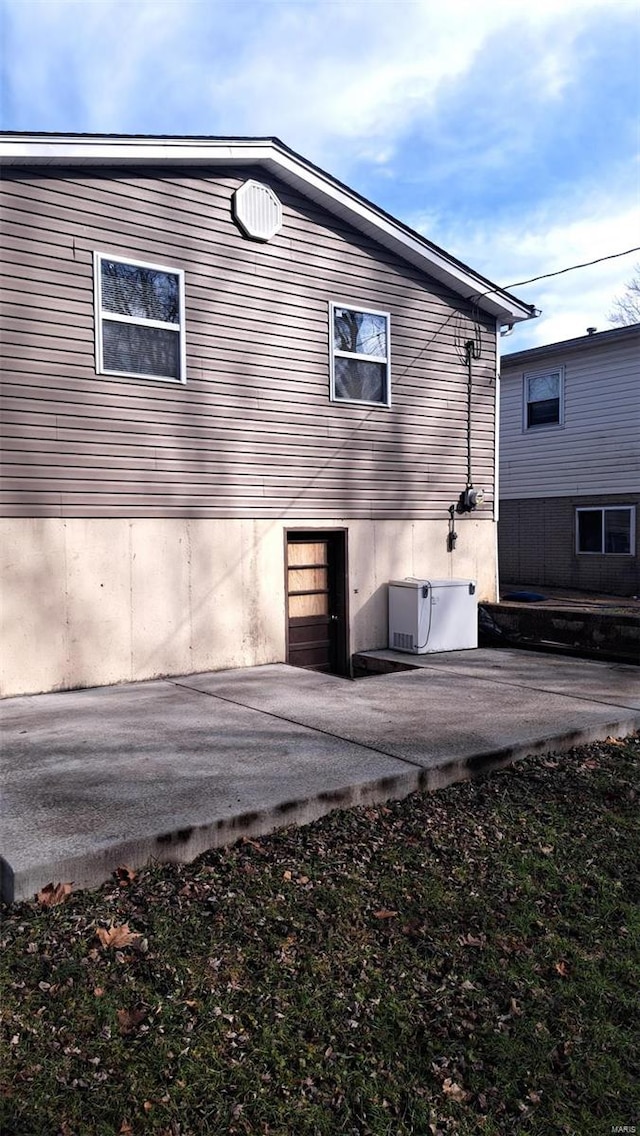 rear view of property with a patio area