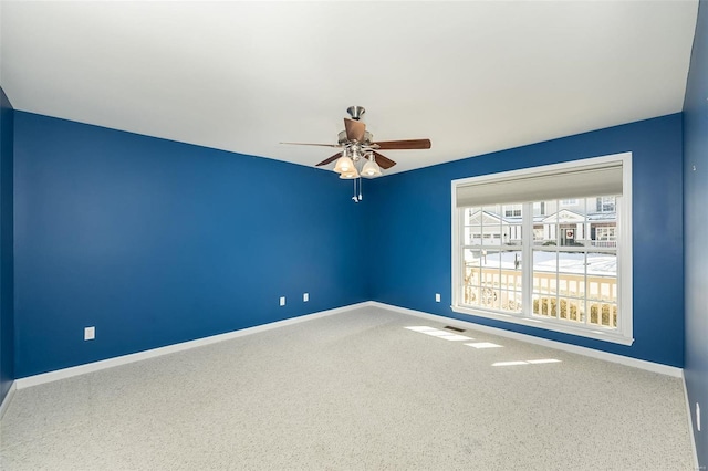 unfurnished room with carpet and ceiling fan