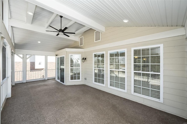 unfurnished sunroom featuring lofted ceiling with beams, a healthy amount of sunlight, and ceiling fan