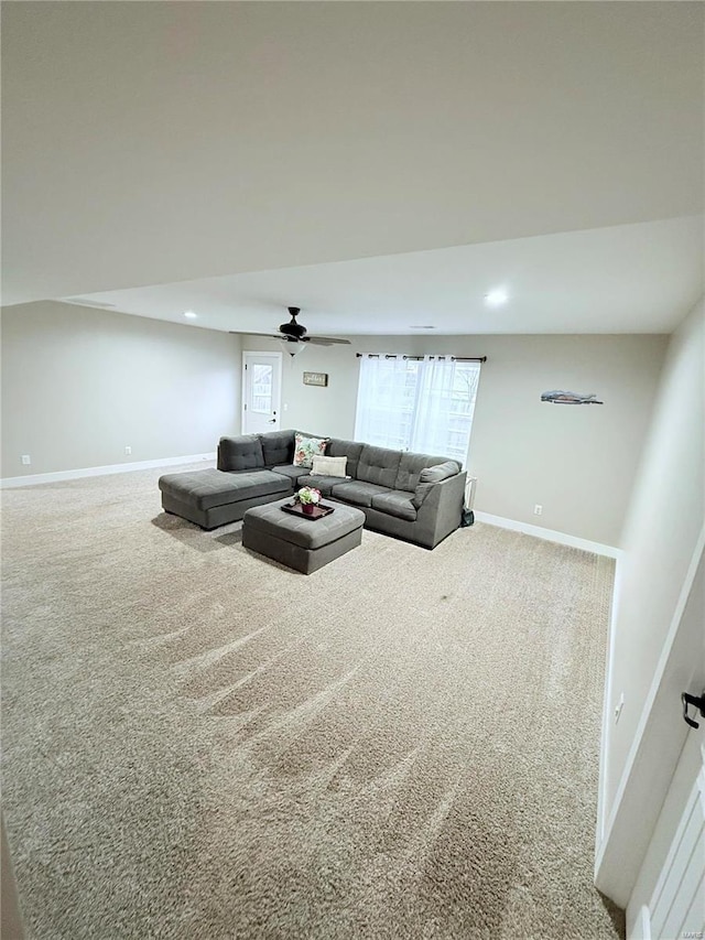 carpeted living area with baseboards, a ceiling fan, and recessed lighting