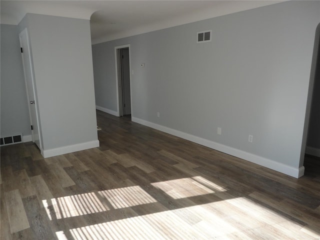 empty room featuring dark hardwood / wood-style floors