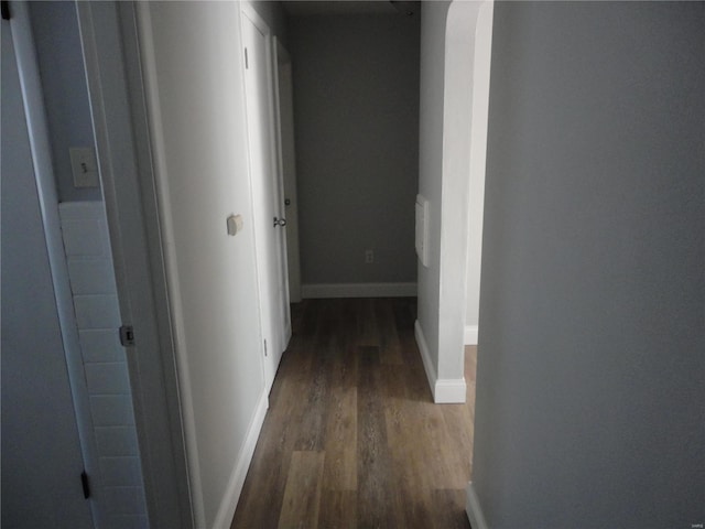 hall with dark hardwood / wood-style flooring