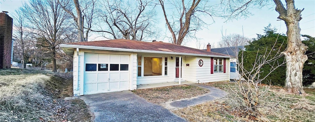 ranch-style home with a garage