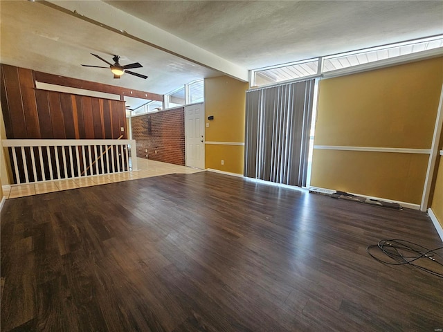 unfurnished room with hardwood / wood-style flooring, ceiling fan, and lofted ceiling